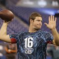 Arkansas quarterback Tyler Wilson runs a drill at the NFL football scouting combine in Indianapolis,...
