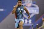 Arkansas running back Knile Davis runs the 40-yard dash at the NFL football scouting combine in Indianapolis, Sunday, Feb. 24, 2013. (AP Photo/Michael Conroy)