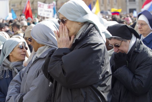 nuns-pray-as-they-wait-for-pope-benedict-xvis-last-angelus-prayer-in-st-peters-square-at-the-vatican-sunday-feb-24-2013-benedict-xvi-gave-his-pontificates-final-sunday-blessing-from-his-studio-window-to-the-cheers-of-tens-of-thousands-of-people-packing-st-peters-square-but-sought-to-reassure-the-faithful-that-he-wasnt-abandoning-the-church-by-retiring-to-spend-his-final-years-in-prayer-the-85-year-old-benedict-is-stepping-down-on-thursday-evening-the-first-pope-to-do-so-in-600-years-after-saying-he-no-longer-has-the-mental-or-physical-strength-to-vigorously-lead-the-worlds-12-billion-catholics