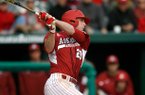 Arkansas' Matt Vinson follows through on an at-bat against Evansville on Saturday, Feb. 23, 2013, at Baum Stadium in Fayetteville.