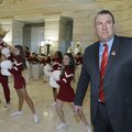 University of Arkansas football coach Bret Bielema, right, attends University of Arkansas Day at the...