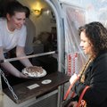 Lauren French, left, holds out a Robert Redford pie for Janette Litaker to inspect Friday at Parks P...