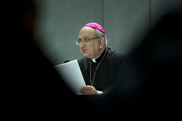 archbishop-pier-luigi-celata-vice-chamberlain-reads-a-copy-of-a-document-signed-by-pope-benedict-xvi-at-the-vatican-on-monday-feb-25-2013-pope-benedict-xvi-has-changed-the-rules-of-the-conclave-that-will-elect-his-successor-allowing-cardinals-to-move-up-the-start-date-if-all-of-them-arrive-in-rome-before-the-usual-15-day-transition-between-pontificates-benedict-signed-a-legal-document-issued-monday-with-some-line-by-line-changes-to-the-1996-vatican-law-governing-the-election-of-a-new-pope-it-is-one-of-his-last-acts-as-pope-before-resigning-thursday