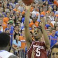 Arkansas guard Anthlon Bell (5) shoots for the basket as Florida's Casey Prather (24) watches during...