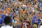 Arkansas guard Anthlon Bell (5) shoots for the basket as Florida's Casey Prather (24) watches during the second half of an NCAA college basketball game in Gainesville, Fla., Saturday, Feb. 23, 2013. Florida won 71-54. (AP Photo/Phil Sandlin)