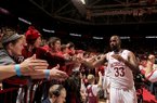 Arkansas junior Marshawn Powell (33) celebrates with fans after defeating Georgia Thursday, Feb. 21, 2013 at Bud Walton Arena in Fayetteville. The Razorbacks won 62-60.