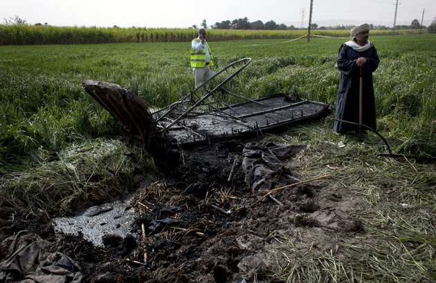 an-egyptian-inspector-of-the-civil-aviation-authority-left-works-at-the-site-of-the-balloon-accident-in-luxor-egypt-on-tuesday-feb-26-2013