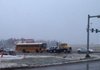Snow fell on traffic Tuesday morning near the Springdale Municipal Airport.
