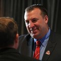 Razorback football coach Bret Bielema greets fans before a Razorback Day at the Capitol lunch in Lit...