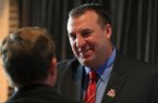 Razorback football coach Bret Bielema greets fans before a Razorback Day at the Capitol lunch in Little Rock.