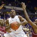 LSU's Anthony Hickey (1) splits Arkansas defenders B.J. Young (11) and Marshawn Powell (33) for a sh...