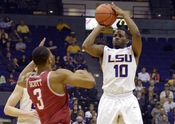 lsus-andre-stringer-10-shoots-a-3-pointer-against-arkansas-rickey-scott-3-during-their-ncaa-college-basketball-game-wednesday-feb-27-2013-in-baton-rouge-la-ap-photothe-advocate-heather-mcclelland