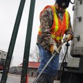 Sam Reynolds with the Arkansas State Highway and Transportation Department in Little Rock uses a tor...