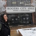 Anne Marie Walsted, Rogers employee, takes in the snowy morning Tuesday at Rogers City Hall. Snow co...