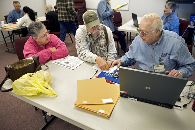 olan-thompson-right-helps-glen-and-gladys-tucker-prepare-their-taxes-at-faith-missionary-baptist-church-in-cabot-the-tuckers-are-taking-advantage-of-the-aarp-tax-aide-program-which-provides-free-tax-assistance