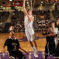 Nick Smith, a Bentonville senior forward, scores over Little Rock Central junior guard Kylon Nichols...