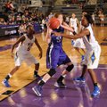 Lauren Schuldt, center, a Fayetteville sophomore forward, pulls down a rebound over North Little Roc...
