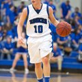 Keifer Holt of Rogers High brings the ball up the court Jan. 8 against Siloam Springs at Rogers. 