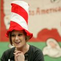 Children’s services assistant Taylor Mills, describes the day’s craft to children at the Springdale ...