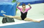 Arkansas gymnast Kelci Lewis executes her floor routine during a meet at Barnhill Arena in Fayetteville.