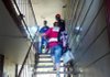 American Red Cross in Arkansas disaster responder Jackie Campbell ascends the stairs after a Little Rock apartment fire to meet with a fire inspector and chief to begin damage assessment and care of displaced families. 