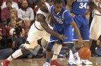 Arkansas junior guard Mardracus Wade, left, steals the ball from Kentucky sophomore guard Ryan Harrow during the first half of play Saturday, March 2, 2013, in Bud Walton Arena in Fayetteville.