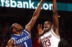 Arkansas' Marshawn Powell shoots over and is fouled by Kentucky's Darius Miller Wednesday, February 23, 2011 at Bud Walton Arena in Fayetteville.