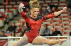 Arkansas gymnast Katherine Grable competes on the beam during Friday night's gymnastics meet at Barnhill Arena in Fayetteville.