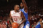 Arkansas junior forward Marshawn Powell (33) attempts to make a move around Kentucky freshman forward Alex Poythress during the first half of play Saturday, March 2, 2013, in Bud Walton Arena in Fayetteville.