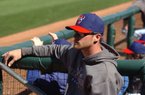 Texas Rangers outfielder Craig Gentry watches a spring training game from the dugout on Thursday, Feb. 28, 2013 in Surprise, Ariz.