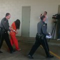 Benton County Sheriff deputies escorted Susan Fleck into the Benton County jail.