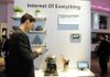 An attendee at the Mobile World Congress, held last week in Barcelona, Spain, checks his device in front of a banner “Internet of Everything.” So-called machine-to-machine technology was all the buzz at this year’s largest wireless trade show, and some analysts believe these types of connections will outgrow the traditional phone business in less than a decade. 