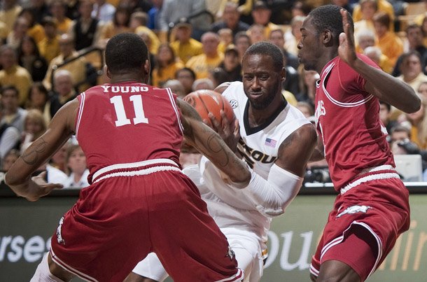 missouris-keion-bell-center-drives-between-arkansas-bj-young-left-and-fred-gulley-right-during-the-first-half-of-an-ncaa-college-basketball-game-tuesday-march-5-2013-in-columbia-mo-ap-photolg-patterson