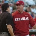 Arkansas coach Dave Van Horn argues a call with the home plate umpire during the Razorbacks' 3-1 los...