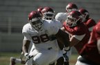 Arkansas defensive tackle Robert Thomas (98) runs a drill during a 2011 spring practice in Fayetteville.