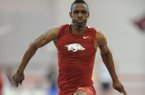 Arkansas' Tarik Batchelor completes his second jump Saturday, Jan. 26, 2013, in the triple jump competition during the Razorback Invitational at the Randal Tyson Track Center in Fayetteville.
