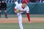Arkansas freshman Colin Poche delivers a pitch Thursday during a game against San Diego State at Baum Stadium in Fayetteville. 