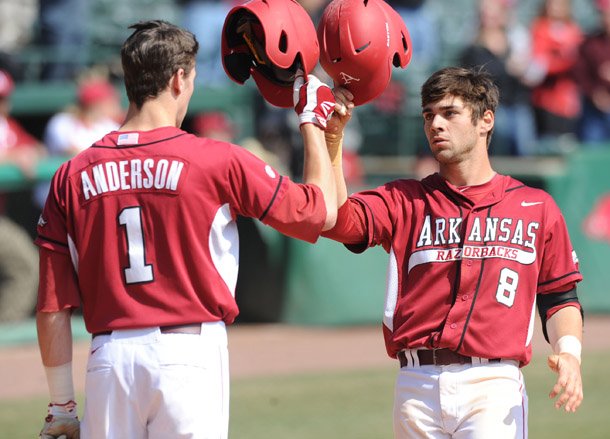 arkansas-center-fielder-tyler-spoon-8-is-congratulated-at-the-plate-by-right-fielder-brian-anderson-after-spoons-solo-home-run-saturday-march-9-2013-during-the-fifth-inning-of-play-at-baum-stadium