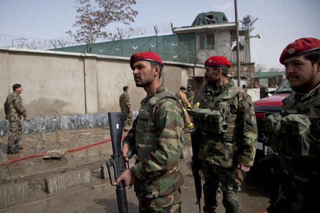 afghan-army-soldiers-take-position-at-the-gate-of-the-afghan-defense-ministry-after-a-suicide-bomber-on-a-bicycle-struck-outside-the-ministry-killing-at-least-nine-afghan-civilians-as-us-defense-secretary-chuck-hagel-visited-kabul-afghanistan-saturday-march-9-2013