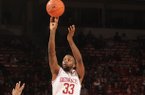 Arkansas junior Marshawn Powell shoots as Georgia junior Donte Williams (15) defends in the second half Thursday, Feb. 21, 2013 at Bud Walton Arena in Fayetteville. The Razorbacks won 62-60.