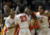 Little Rock Hall’s Evan James (center) celebrates with teammates after making a last-second basket to beat Jonesboro 34-33 in the Class 5A boys high school championship game on Saturday at Barton Coliseum in Little Rock. 