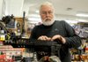 Jim Watson of Huntsville attaches a rear sight to an AR-15 semiautomatic rifle Wednesday at Wilson Combat, a maker of firearms in Berryville that is restricting sales to some law-enforcement agencies. 