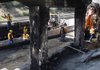 Arkansas Highway and Transportation Department crews begin work Friday on reinforcing concrete columns on the Young Road overpass at Interstate 40 in North Little Rock after Thursday’s fi ery crash. 