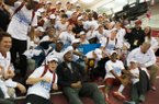 The Arkansas men's track and field team celebrate after winning the NCAA Division I Indoor Track and Field Championship in Fayetteville, Ark., Saturday, March 9, 2013. (AP Photo/April L. Brown)