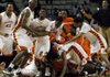 Little Rock Hall boys basketball players celebrate after Evan James made a game-winning shot as time expired to beat Jonesboro 34-33 in the Class 6A state championship game in front of 8,361 on Saturday night at Barton Coliseum in Little Rock. 