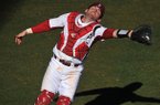 Arkansas catcher Jake Wise reaches for a foul ball during a Feb. 19 game against New Orleans at Baum Stadium.