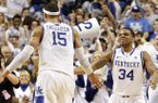 Kentucky's Willie Cauley-Stein, left, and Julius Mays celebrate after Kentucky upset No. 11 Florida 61-57 in an NCAA college basketball game at Rupp Arena in Lexington, Ky., Saturday, March 9, 2013. (AP Photo/James Crisp)