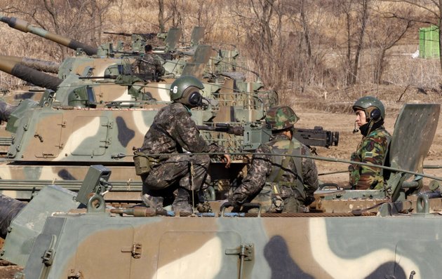 south-korean-army-soldiers-sit-on-their-k-9-self-propelled-artillery-vehicle-during-an-exercise-against-possible-attacks-by-north-korea-near-the-border-village-of-panmunjom-in-paju-south-korea-monday-march-11-2013-south-korea-and-the-us-on-monday-kicked-off-an-annual-military-drill-amid-worries-about-a-possible-bloodshed-following-north-koreas-threat-to-scrap-a-decades-old-war-armistice-and-launch-a-nuclear-attack-on-the-us