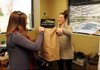 NWA Media/ANTHONY REYES
Julie Petree, manager of marketing and communication for the United Way of Northwest Arkansas, hands Alicia Burch, with Signature Bank, a bag filled with t-shirts Monday, March 11, 2013 at the United Way offices in Lowell. The Bank will have volunteers participating in the Day of Caring on Wednesday and the volunteers are given the shirts to wear while volunteering. Approximately 500 volunteers are signed up to provide 40 non-profits with aid.