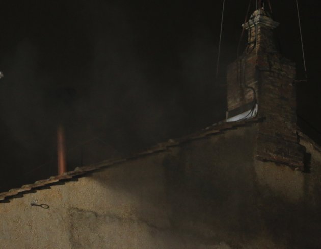 black-smoke-emerges-from-the-chimney-on-the-roof-of-the-sistine-chapel-in-st-peter-s-square-at-the-vatican-tuesday-march-12-2013-the-black-smoke-indicates-that-the-new-pope-has-not-been-elec